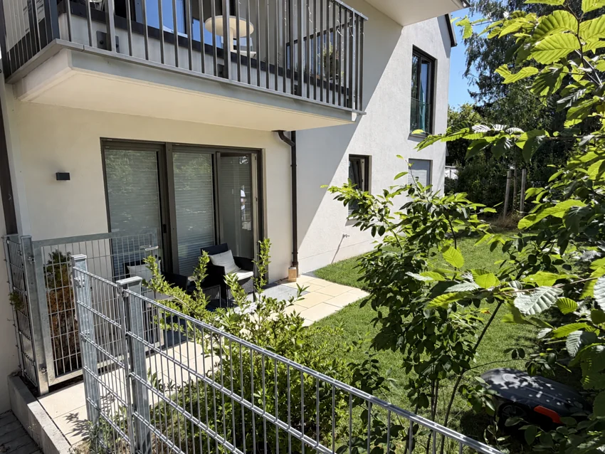 Small south-facing terrace with seating and garden